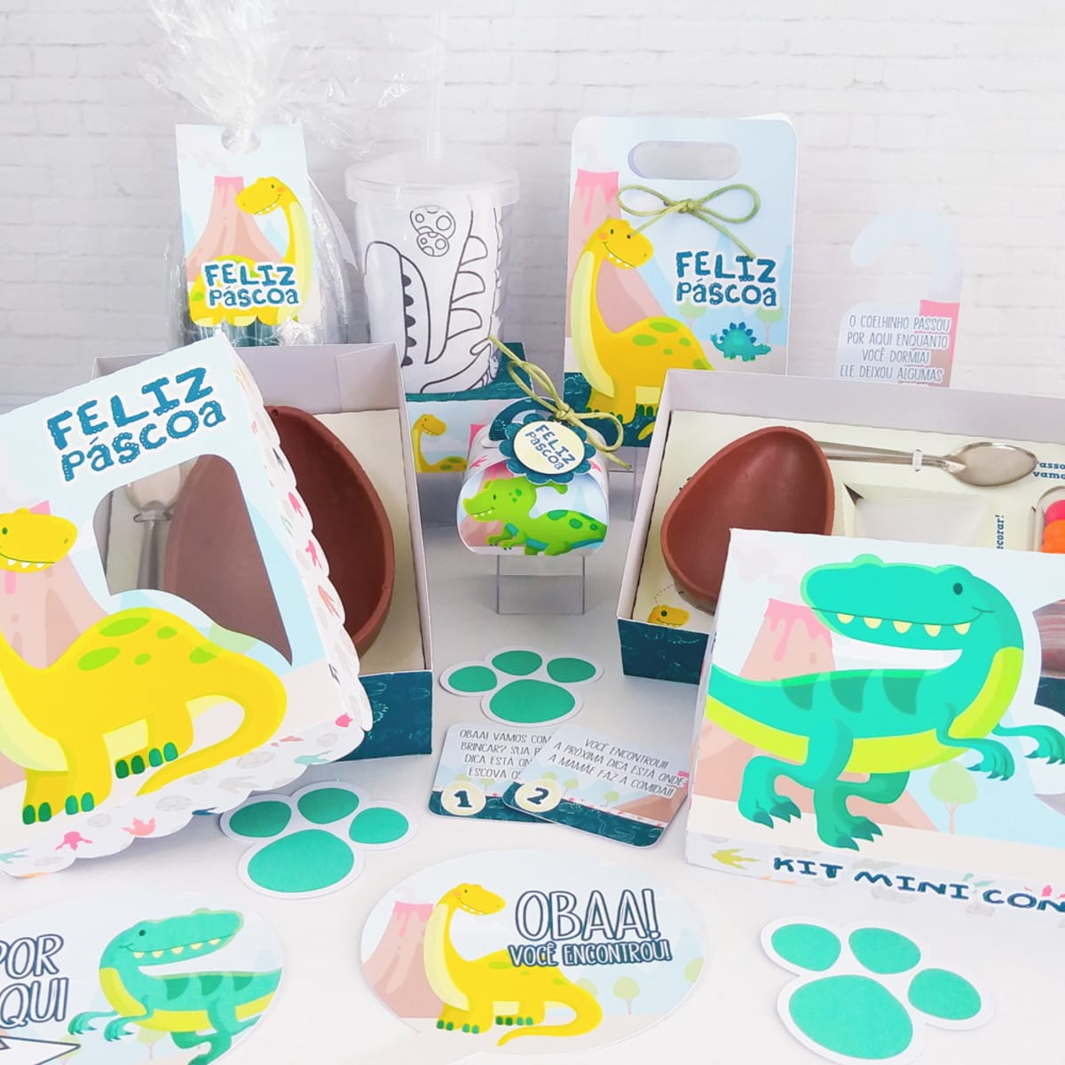 17 Kits de Corte Páscoa Arquivo Digital 5 Kit de Páscoa infantil com arte digital vibrante de dinossauros em embalagens e cartões.