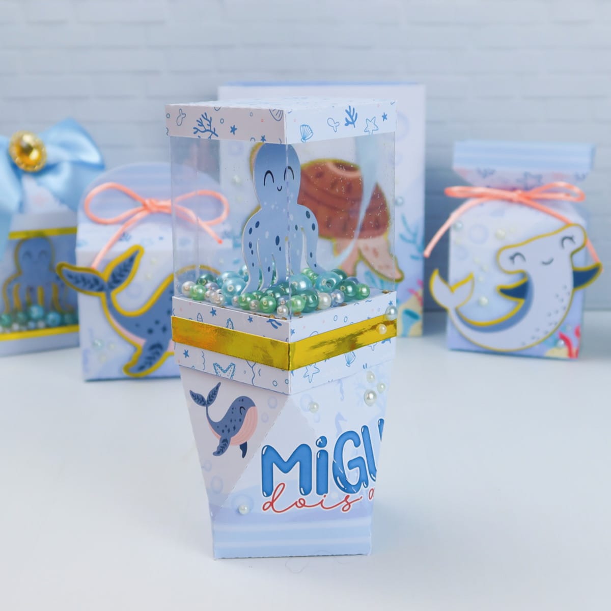Arquivo Digital Festa Marinha com Moldes de Caixas 3 Caixa de papel personalizada com tema marinho e visor transparente com polvo