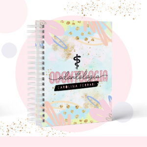 Caderno espiral com capa personalizada com motivos de odontologia e elementos gráficos coloridos.