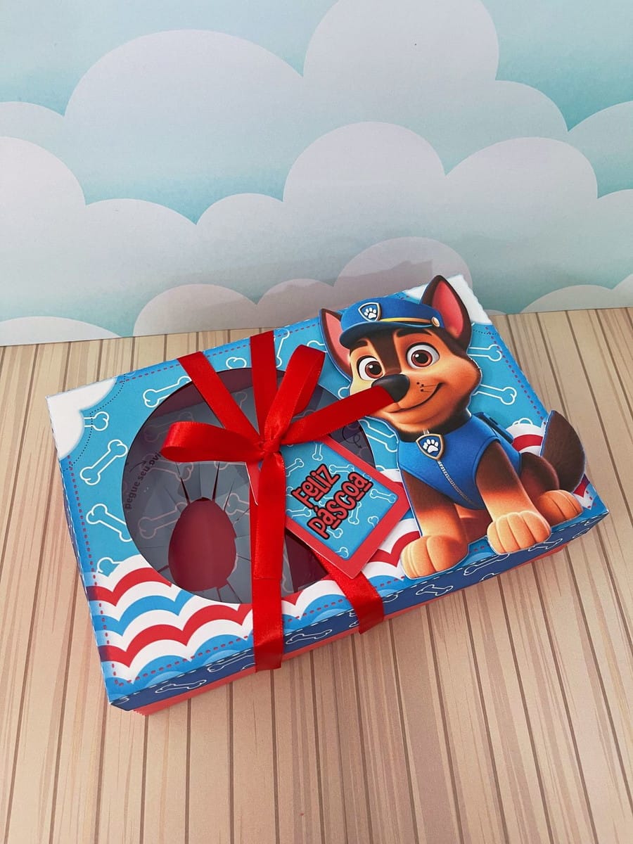 Caixa Mini Confeiteiro Patrulha Canina Digital 3 Caixa retangular decorada com desenho de cachorro, laço vermelho e mensagem de Páscoa.
