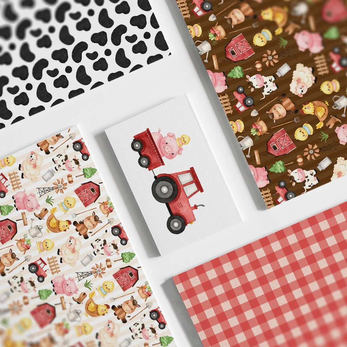 Folhas de papel com ilustrações de fazenda e estampas sobre fundo branco.