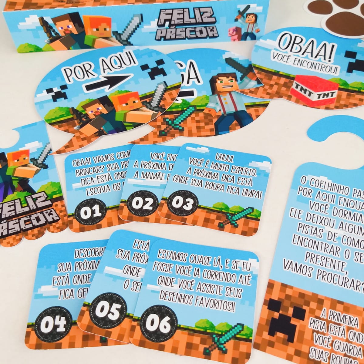 Kit Páscoa Minecraft Arquivo Digital para Confeiteiros 5 Diversos cartões coloridos com textos e personagens em estilo pixelado sobre fundo branco.