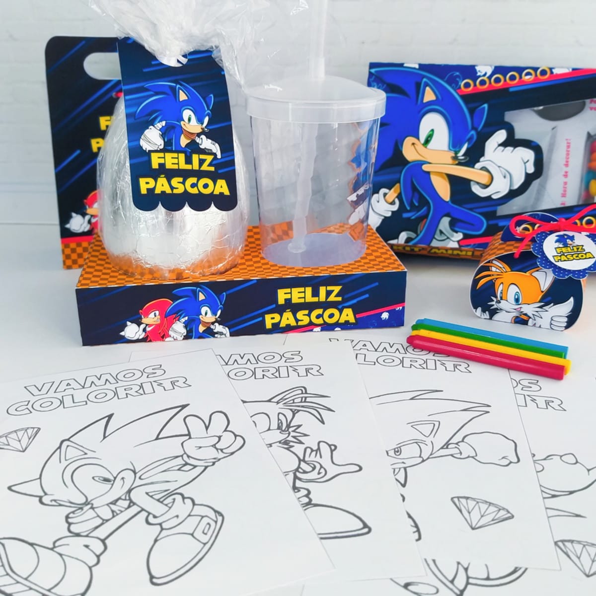 Arquivo Digital Kit Páscoa Sonic para Confeiteiros 4 Design de Páscoa com personagem azul, arte de ovo, copo, caixas e páginas para colorir.